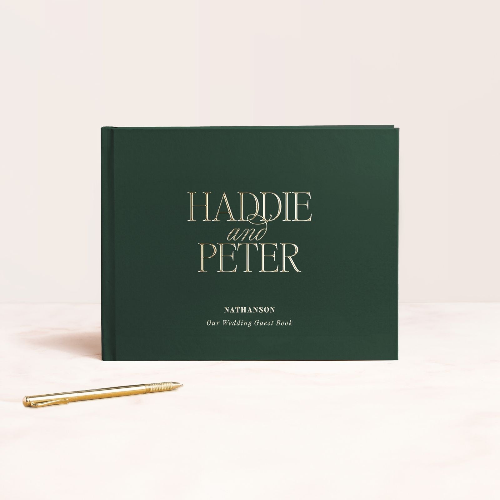 a book with a pen next to it