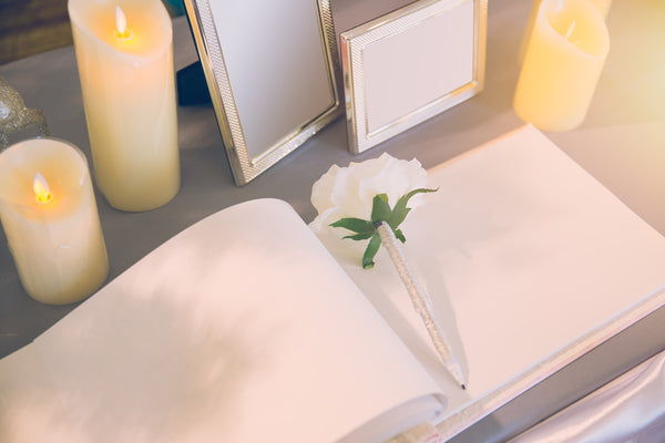 Wedding Guest Book Surrounded by Candles